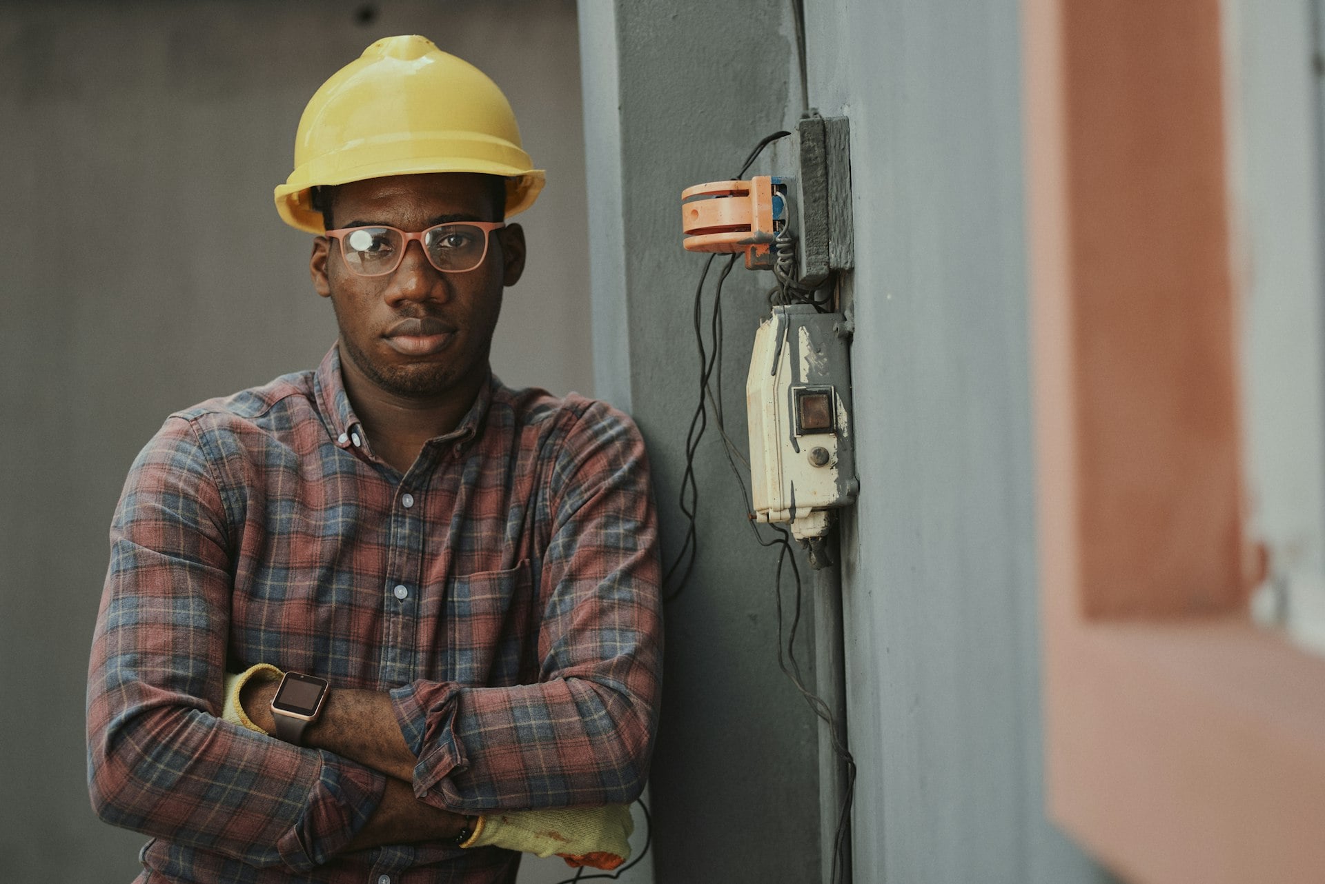 Worker using mobile device on construction site